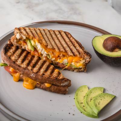 Grilled Cheese Sandwich with Cajun Chicken, Avocado, Tomato, and Canadian Orange Cheddar