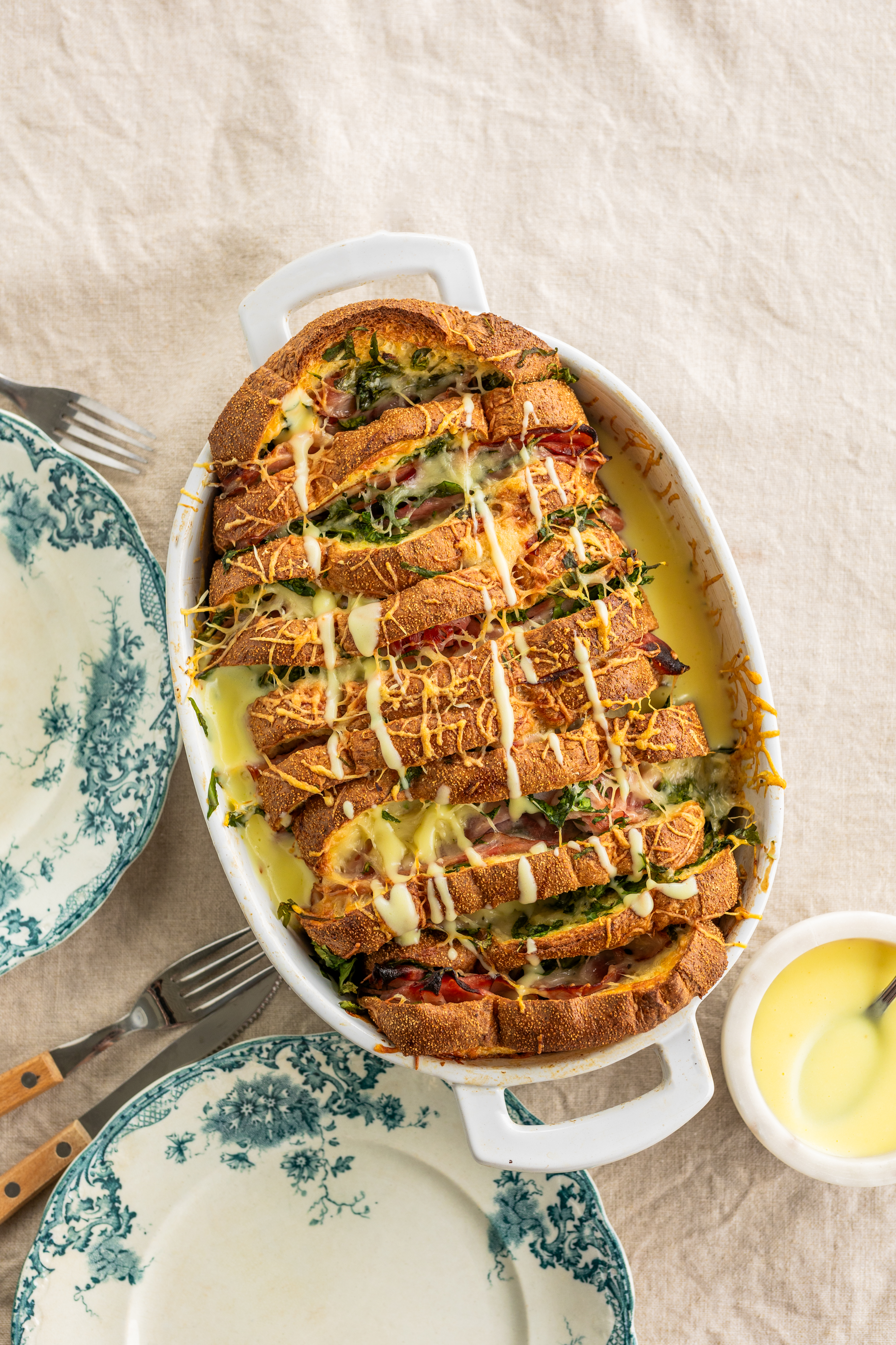 French toast casserole with ham, gruyère, and hollandaise sauce