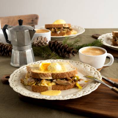 Hot Chicken-style Eggs Benedict, with Duck Confit, Leeks, and Orange Hollandaise Sauce